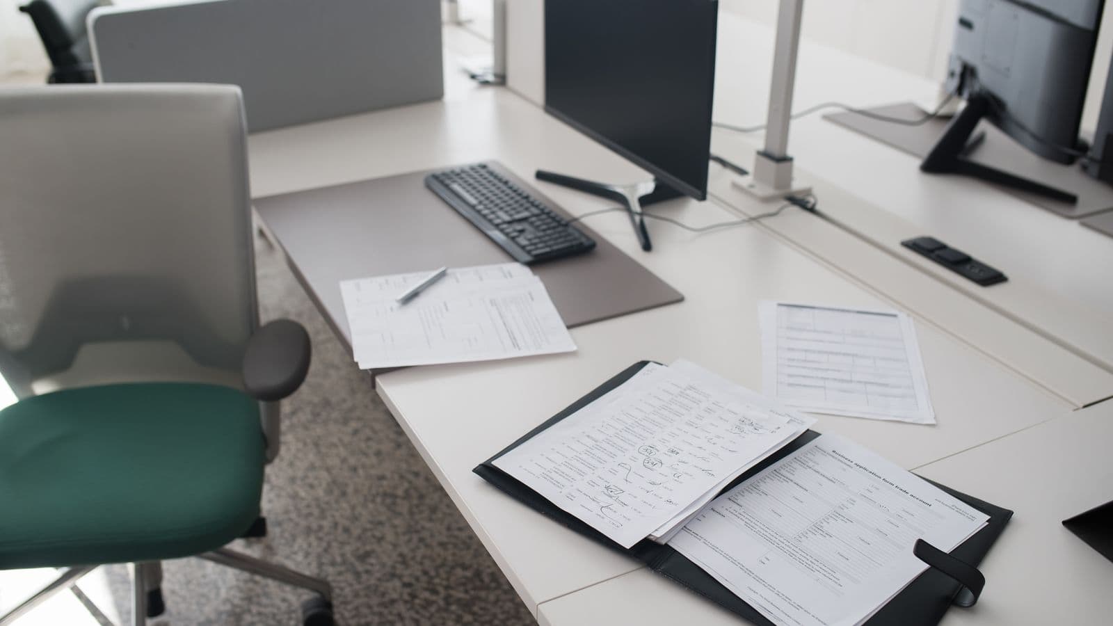 Federal Travel Regulation documents and per diem rate tables on a government office desk