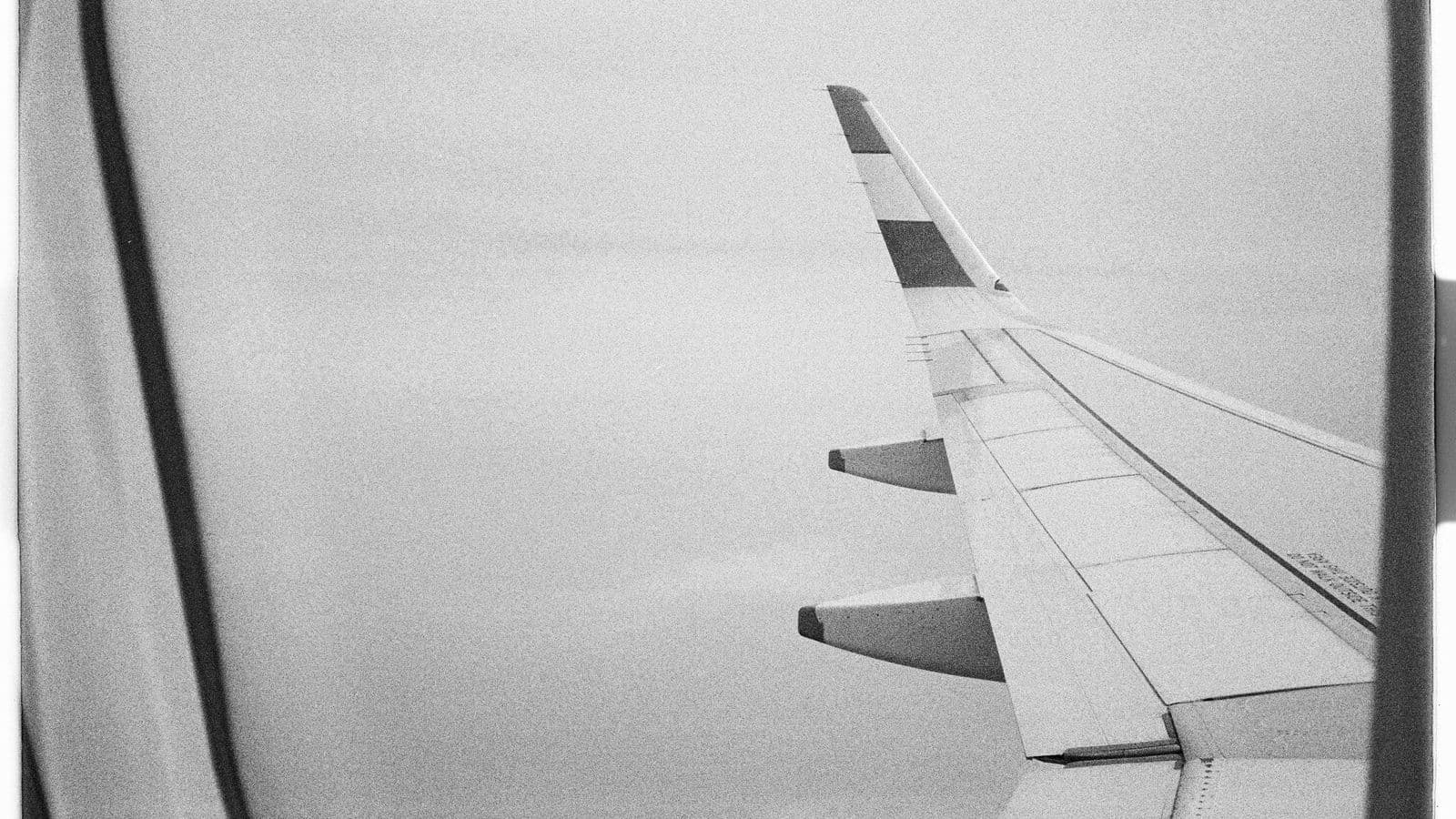 View from an airplane window mid-flight, representing a partial first or last day of business travel